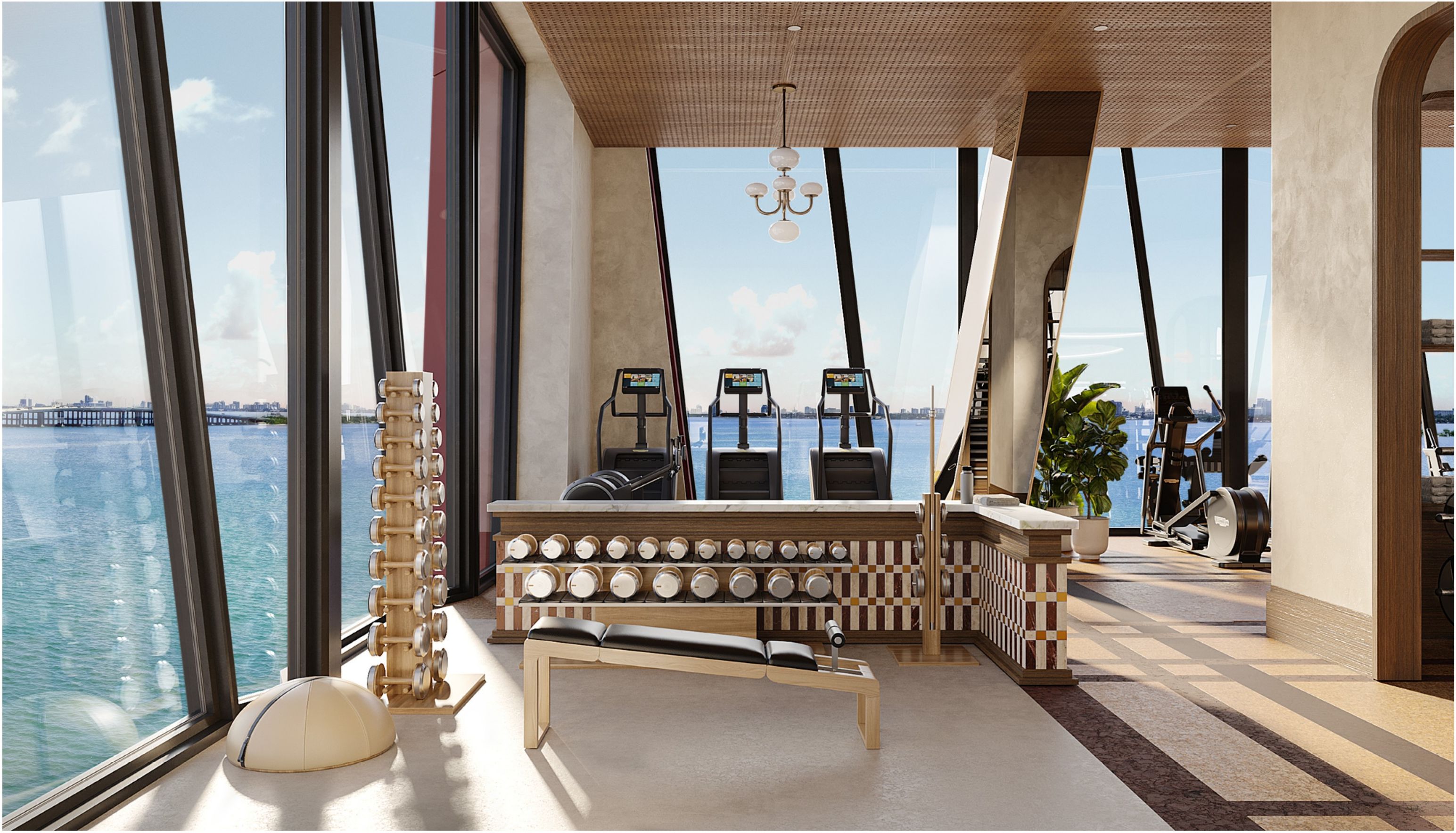 Technogym fitness floor with floor-to-ceiling bay views